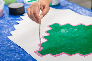 Close up of a portion of the the Take the Risk to Cool down Mural being painted.