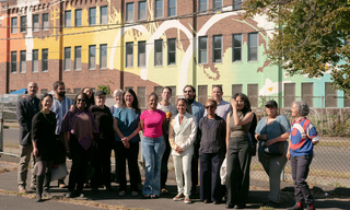 A Group shot of the Cooling Murals team in front of one of their largest murals.